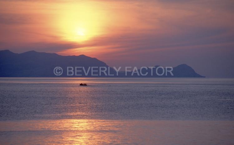 Island Sunsets;sky;sillouettes;sunset;water;red;colorful;yellow;ocean;Indonesia;purple